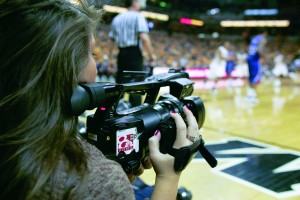 Student Capturing Video at MU Basketball Game