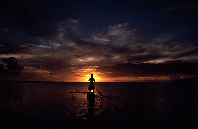 Man Paddling Out to Sea