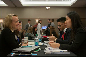 Terry Hoffman, senior vice president at FleishmanHillard, smiles while chatting with students. FleishmanHillard is headquartered in St. Louis and has more than 80 offices worldwide.