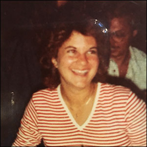 Janice (Kalmar) McDill, BJ '82, smiles for a photograph as an undergraduate.