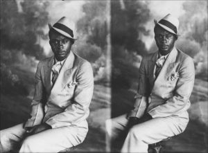 Man in double-breasted suit and hat. From a 5x7 glass plate, split-back negative, circa 1925.