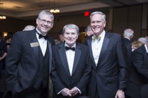 From left: John Anderson, BJ '87; Jim Lehrer, BJ '56; and Dean David Kurpius.