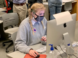 Sara Marquardt, a senior from St. Joseph, Missouri, designs the front page of the Nov. 4, 2020, print edition of the Columbia Missourian. Photo by Nate Brown | copyright: 2020 - Curators of the University of Missouri