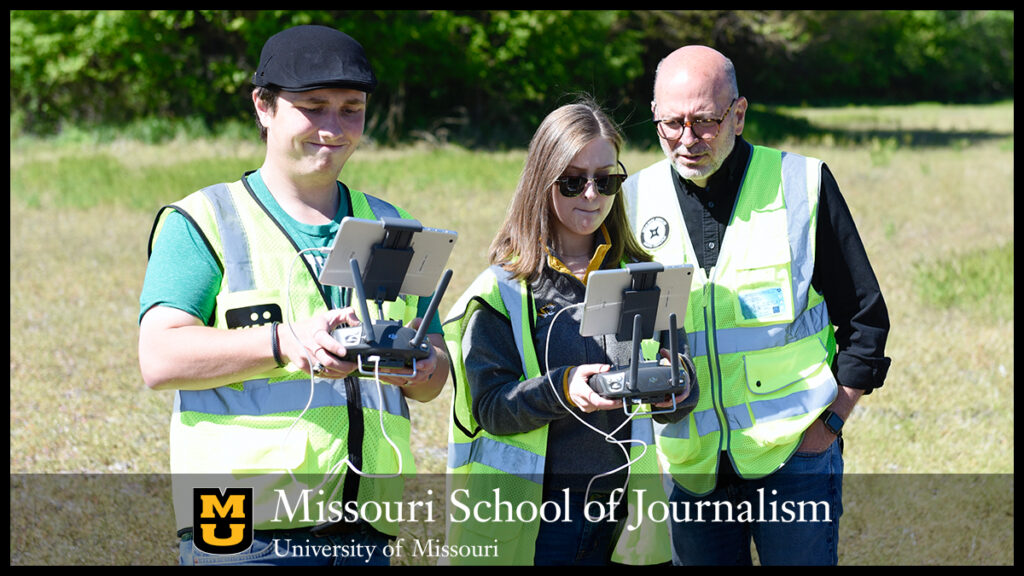 Junior Jake Young, left, and senior Grace Vance, center, operate an Inspire 2 drone near The Big Tree on May 12, 2021. The two took turns flying and taking photos and video. Looking over Vance's shoulder is Professor Stacey Woelfel. Photo by Nate Brown | copyright: 2021 - Curators of the University of Missouri