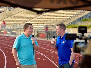 Senior Sterling Price speaks with Sports Director Ben Arnet during the 6 p.m. newscast live from Jefferson City High School. Price introduced a sports story he filmed and edited over the past week. Photo by Nate Brown | copyright: 2021 - Curators of the University of Missouri.