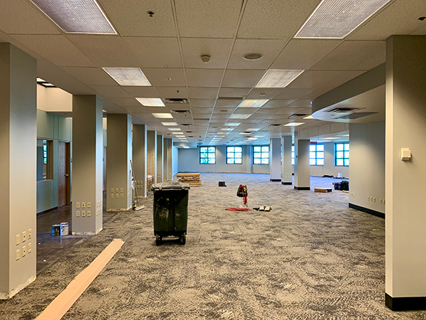 New carpet goes down into the new shared newsroom. | Photo: Nate Brown