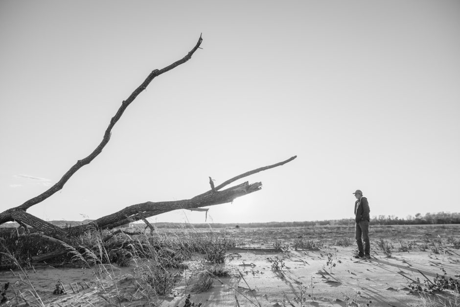 In Kim's photo story "After the Rain," Stephen Diederich looks at a fallen tree after flooding on his farmland in Wilton, Missouri on Nov. 2, 2019. Photo courtesy of Yehyun Kim.