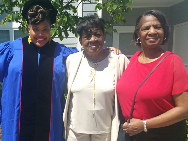 Luisi when she graduated from the University of Kansas, along with her mother, Debra Robinson (center) and her grandaunt, Erma Butler (far right).
