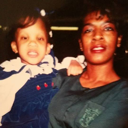 Young Monique with her mother, Debra Robinson.