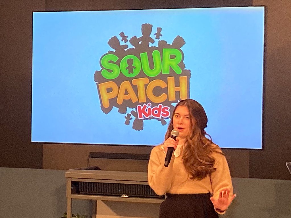 MOJO Team menagerie member McKenna Need presenting campaign ideas to Fall 2022 client Sour Patch Kids on Dec. 7, 2022 in Smith Forum, Reynolds Journalism Institute.
