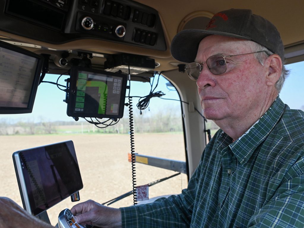 Frank Glenn operates a tractor while planting corn at Glendale Farm and Stables in Columbia, Mo. The farm uses satellite technology to aid in adding precise amounts of nutrients where the soil needs it. Photo: Maya Bell | Mississippi River Basin Ag & Water Desk