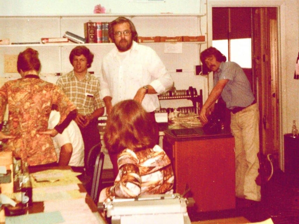 Inside the KOMU newsroom in the late 1970s. Lance Heflin, BJ '77, at far right. Ellen Jaffe Jones, BJ ’76, in foreground. Leigh Wilson, KOMU news director at the time, in white shirt. Photo courtesy Cathy Lasiewicz