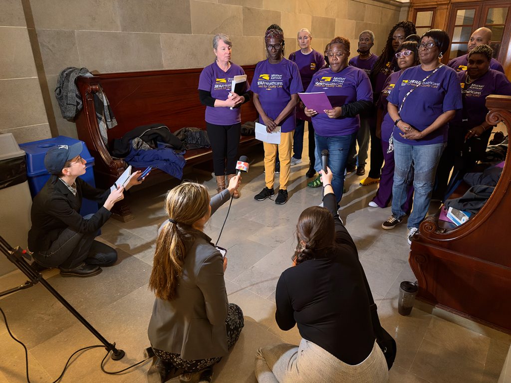 Missouri School of Journalism students Evy Lewis, Tia Maggio and Sigi Ris cover a press conference at the Missouri Statehouse in 2023.