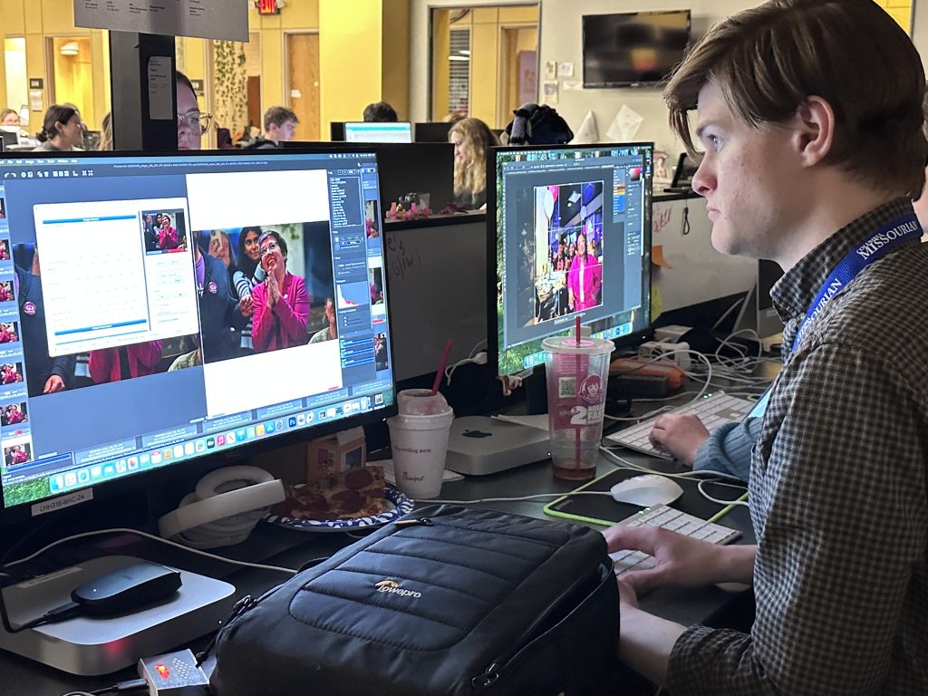 Photojournalist Michael Baniewicz edits a photo he made earlier in the evening of Mayor Barbara Buffaloe at the incumbent’s watch party on April 8, 2025, at Ozark Mountain Biscuit and Bar. Photo by Nate Brown