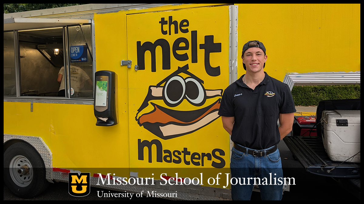 Connor McHugh standing in front of The Melt Masters food truck