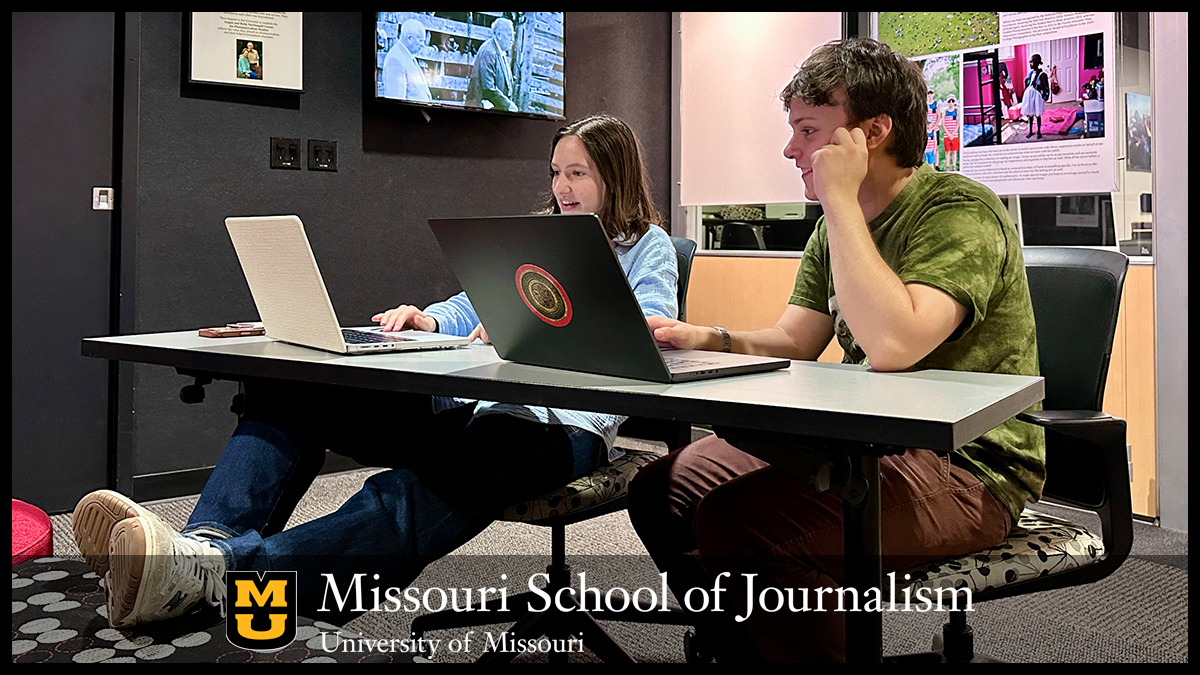 Luca Giordano, right, a junior from St Louis who’s studying documentary journalism and history, meets with Washington, D.C., photojournalist Allison Robbert for a portfolio review on Sept. 11, 2025, in the McDougall Center gallery. Photo: Nate Brown