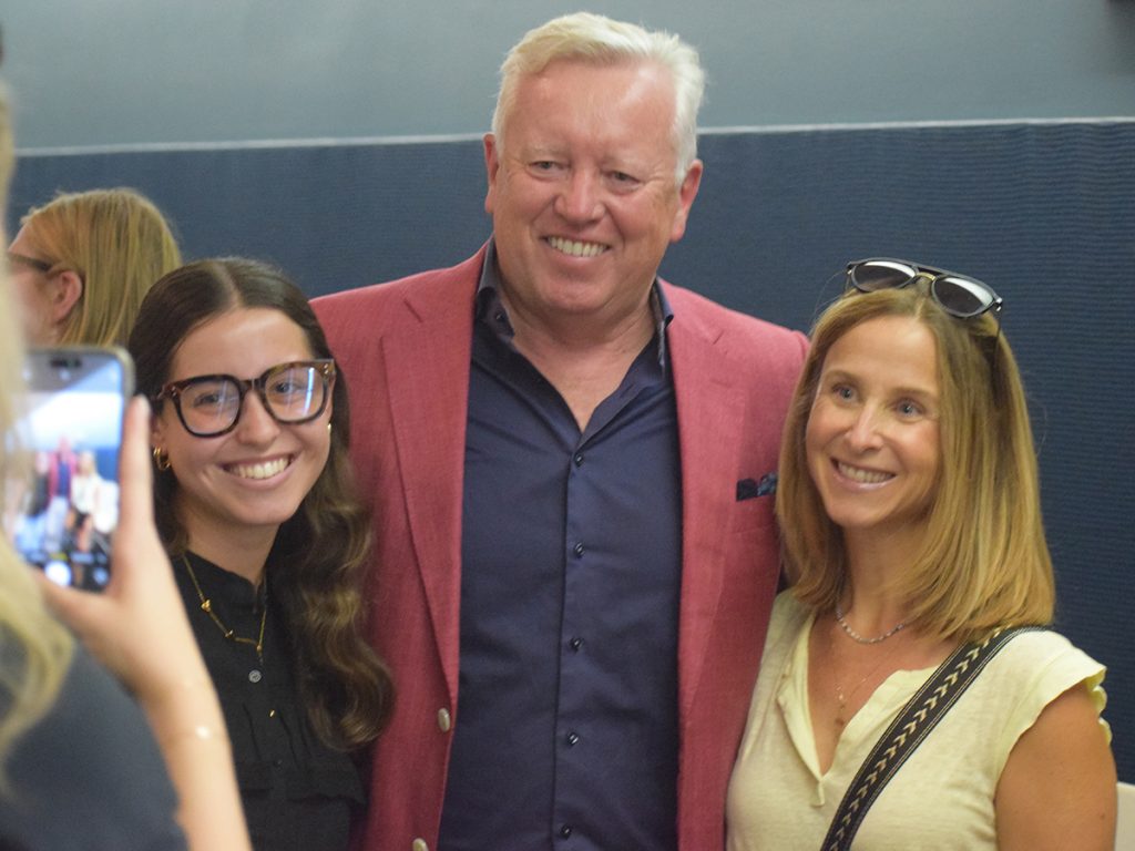 John Saunders, the chairman and former president and CEO of global communications consultancy FleishmanHillard, poses for a photo with members of the audience from his master class.Photo: Joanie Straub