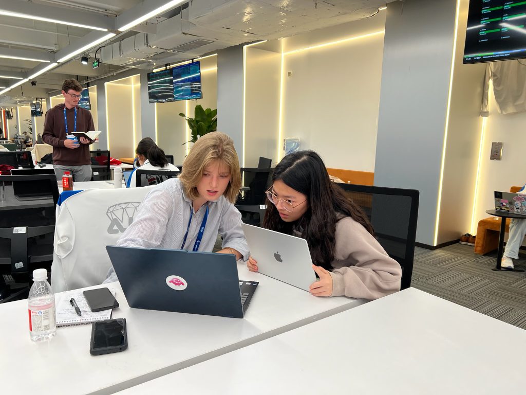 Junior Mia Fleischer (left) with ICUC student Miaomiao Huang.
