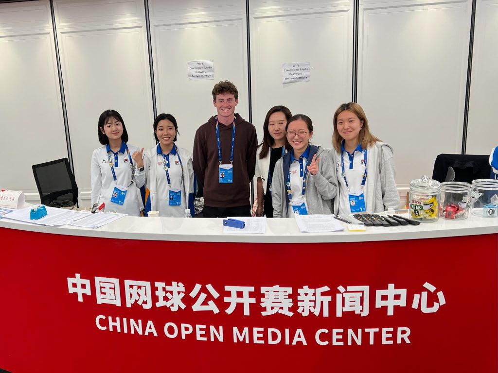 Senior Evan Kohn (center) with ICUC students at the China Open Media Center.