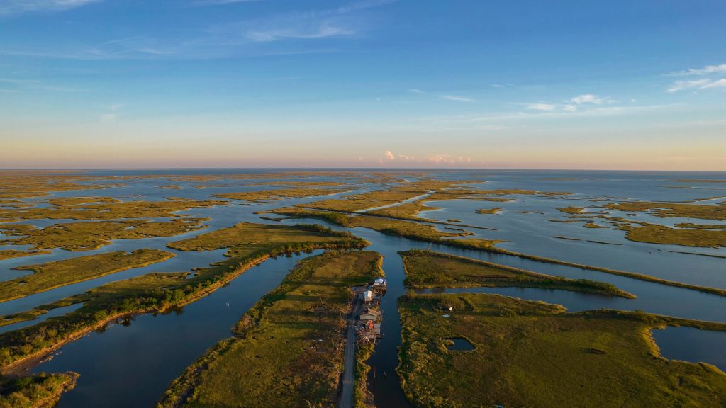 The well-worn stat — that Louisiana loses a football-field of bayou every hour — is more or less true. The rate may ebb and flow, but Louisiana loses, according to the U.S. Geological Survey, about 32 square miles of land a year. There are many reasons for it, including land subsidence, oil and gas infrastructure that cuts through the bayou, climate change and sea level rise. Photo: Julia Rendleman