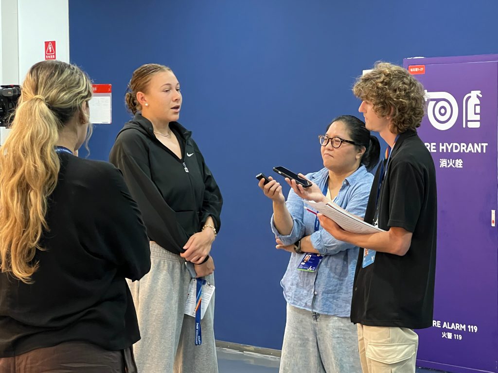 Senior Dane Vogel (far right) interviews Amanda Anisimova, the No. 4 women’s singles tennis player in the world.