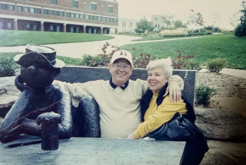 Gary Neil Schmedding and RoseMarie Schmedding at Beetle Bailey bench on Mizzou campus
