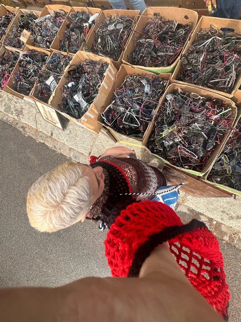Ryza rifling through a flea market in Europe looking for eyeglass frames
