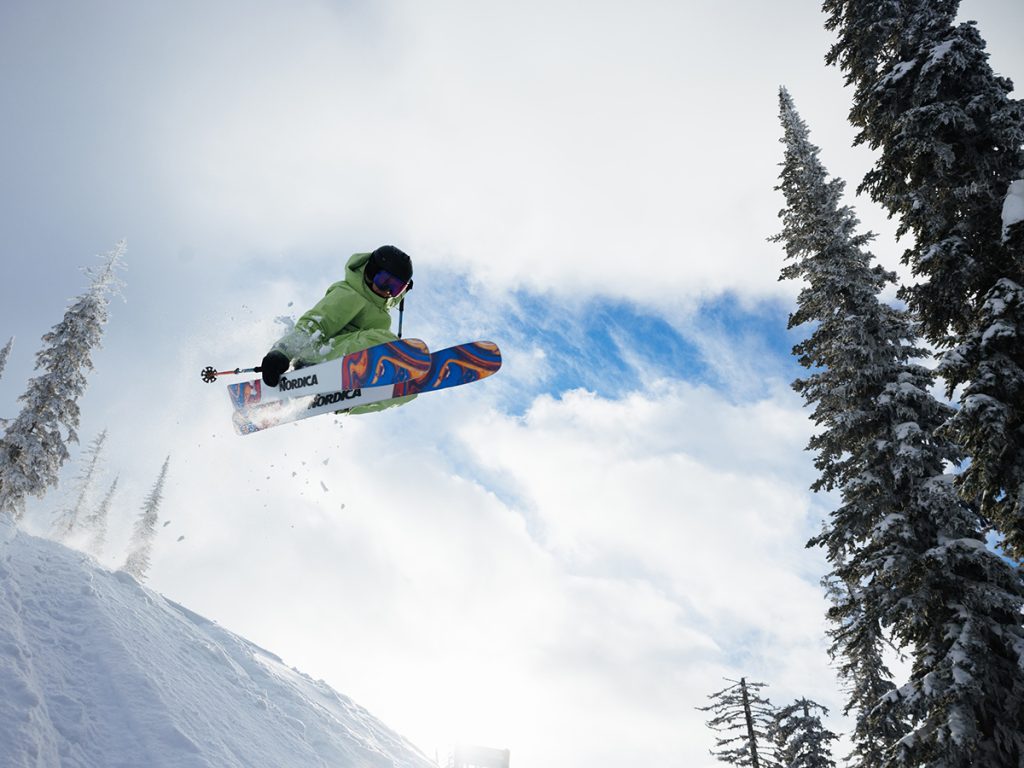 Erin Spong skiing down a snow-covered mountain