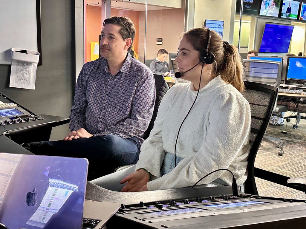 Grace Ainger [right] with J.D. Pruess, a former co-executive producer of American Ninja Warrior who began his career as a sports reporter and producer, during his visit to campus in November. Photo: Nate Brown