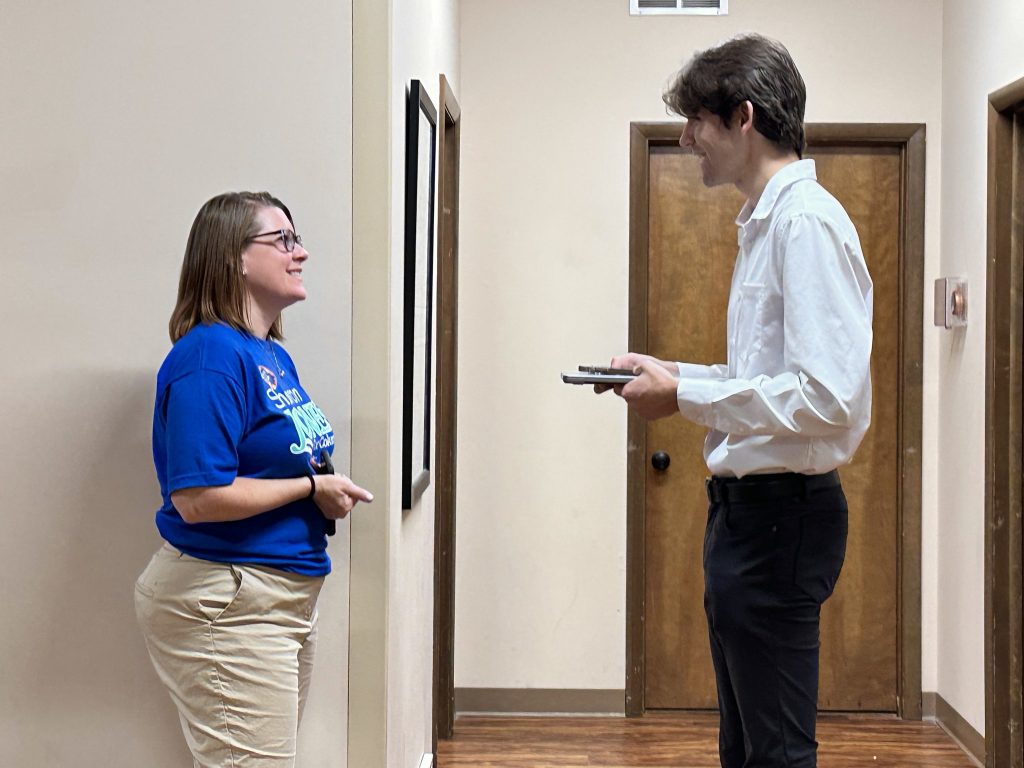 Senior Eric Hughes, right, interviews Sharon Jones on Aug. 4, 2026, after Jones delivered her victory speech at her watch party at LIUNA Local 955.