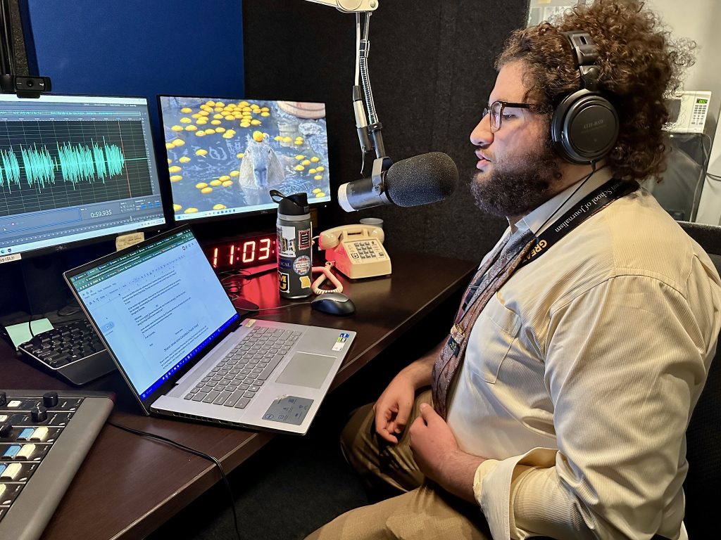 KBIA-FM’s Yazin Merayyan records his election story in a recording booth.